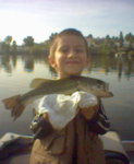 Josh with bass on boat.jpg Josh with bass on boat.jpg